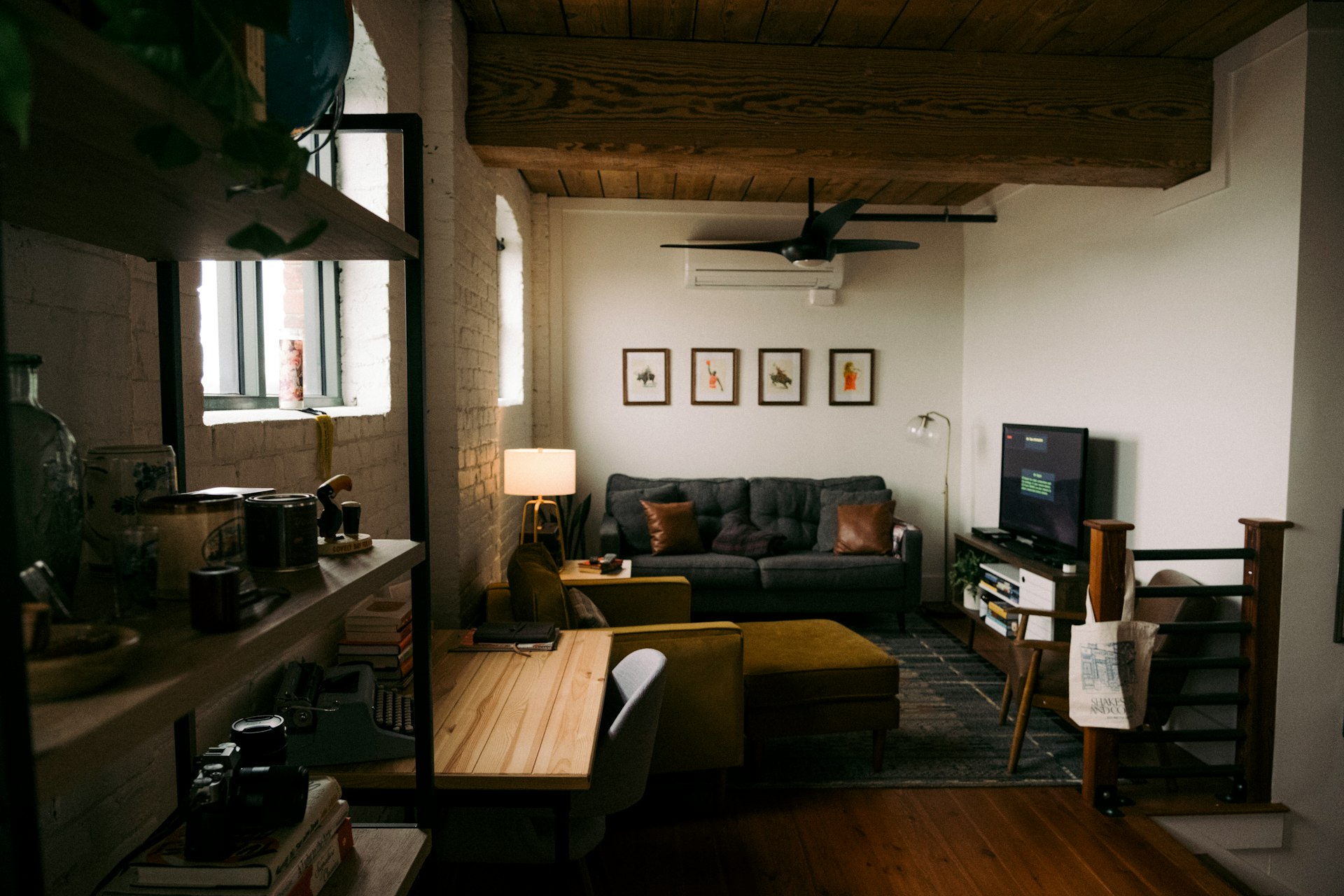 a living room filled with furniture and a flat screen tv